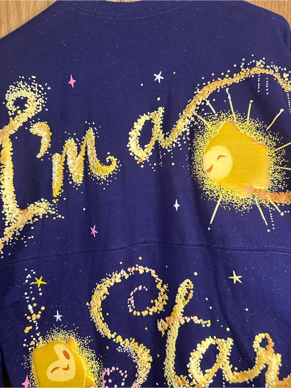 Disney Navy Crewneck Sweatshirt with Yellow Starburst Graphic